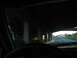 1995 Ford C-350 (Centurion Conversions) - View from inside a vehicle driving under an overpass on a highway.