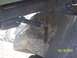 1989 Ford Bronco - The underside of a vehicle is visible, supported by large rocks, with a timestamp indicating the photo was taken on March 18, 2007.