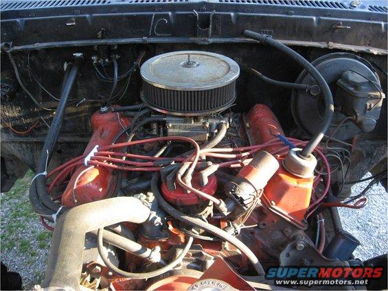 Engine bay with V8 engine, carburetor, and air cleaner