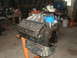 1980 Ford F-250 - V8 engine on an engine stand in a workshop setting.