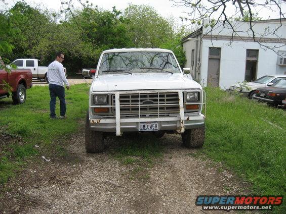 White Ford F-series truck with a brush guard and license plate BMD-W58