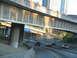 1995 Ford C-350 (Centurion Conversions) - Traffic moves along a highway under a concrete overpass with city buildings visible.