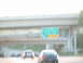 1995 Ford C-350 (Centurion Conversions) - Driving on the highway past other cars and an overpass with a street sign.