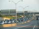 1995 Ford C-350 (Centurion Conversions) - A long line of vehicles are stuck in traffic on a multi-lane highway under an overpass.