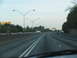 1995 Ford C-350 (Centurion Conversions) - A view from a vehicle on a highway with multiple lanes and other cars.