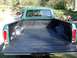1977 Ford F-150 - Rear view of a 1977 Ford F-150 pickup truck showing the bed with a black spray-in liner.