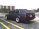 1989 BMW 3 Series - This 1989 BMW 3 Series coupe is shown from the rear 3/4 angle, aftermarket wheels and a spoiler.