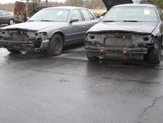 Two wrecked 1991 Ford Crown Victoria LTDs, front view