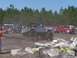 1989 Ford Bronco - A Jeep navigates an obstacle course during an outdoor event, with spectators gathered around.
