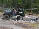 1989 Ford Bronco - A black Jeep Wrangler Rubicon tackles an off-road obstacle course with concrete pipes in 2007.