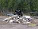 1989 Ford Bronco - Off-road vehicle navigates a challenging obstacle course with a pickup truck nearby.