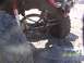 1989 Ford Bronco - Close-up of a muddy off-road vehicle's rear suspension and tire, with a date stamp of 03/18/2007.