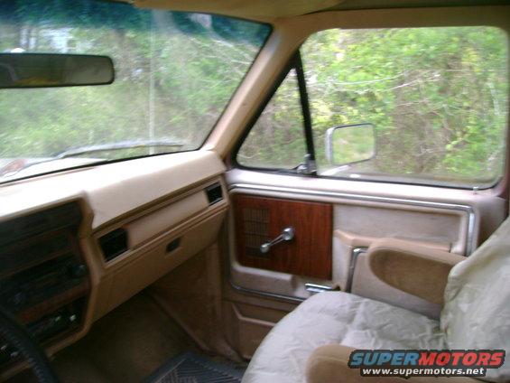 Interior view of a 1989 Ford Bronco, showing the dashboard and passenger seat
