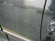 1997 Ford F-150 - Scratches on a vehicle door spell out the word 'truck'.