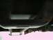 1997 Ford F-150 - The underside of a vehicle's frame is visible, showing some rust and structural components.