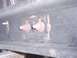 1997 Ford F-150 - Close-up view of a vehicle crossmember a mounting plate with two bolts.