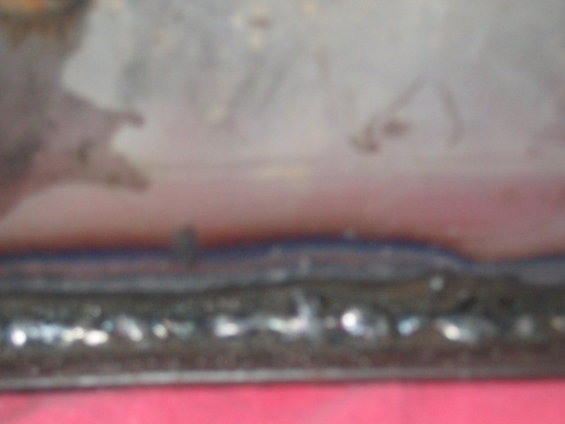 close-up of a rough metal seam, possibly from a vehicle repair