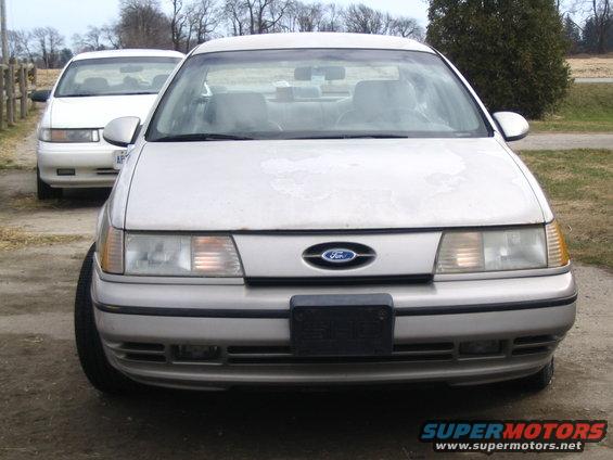 Front view of a 1993 Ford Taurus with a second car behind it