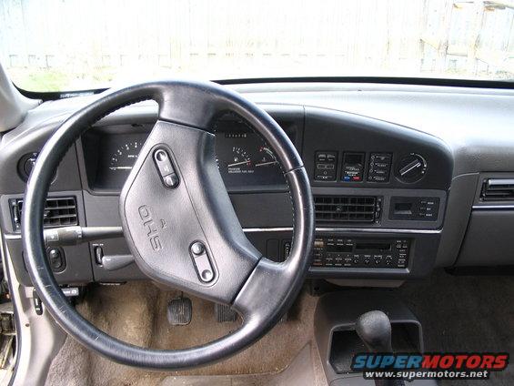 1993 Ford Taurus interior showing steering wheel, dashboard, and center console