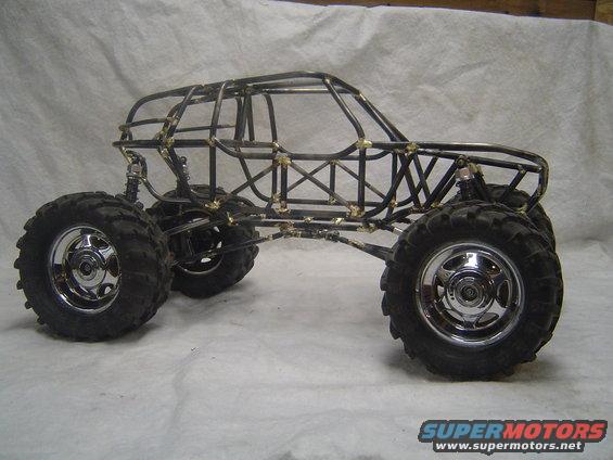 Tube frame chassis with large tires and suspension components, unfinished