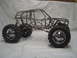 1993 Ford Bronco - Custom tube frame chassis with large off-road tires and suspension, ready for bodywork.