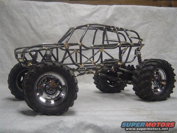 Custom tube chassis rock crawler with large tires and chrome rims