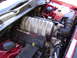 2006 Dodge Charger - The engine bay of a 2006 Dodge Charger displays its HEMI 6.1L engine, complete with intake and coolant systems.