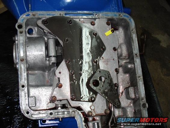 Transmission pan with valve body and gasket removed, showing internal components