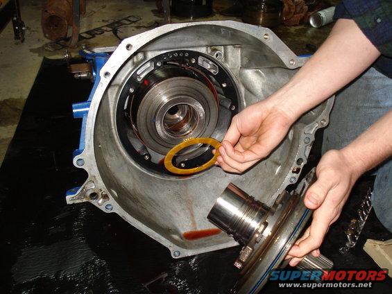 Transmission torque converter and housing being worked on, with a yellow gasket