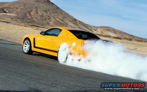Yellow 2007 Saleen S-302 doing a burnout on a track