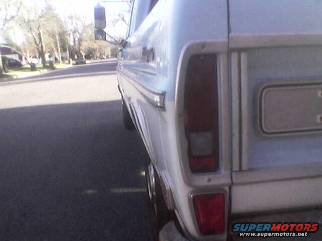 Rear quarter panel and taillight of a 1967 Ford F-series truck