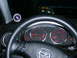 1994 Ford Probe - Interior view of a car's dashboard, gauges and a steering wheel with controls. A boost gauge is mounted on the dash.