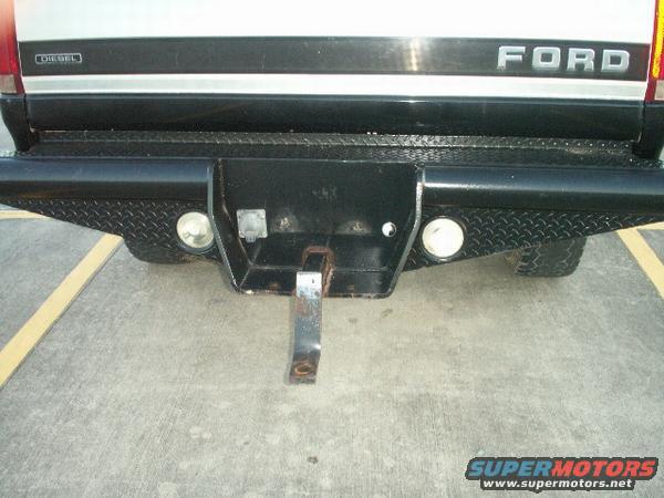 1997 Ford F-350 rear bumper with diamond plate accents and a hitch receiver
