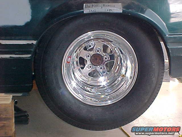 1992 Ford Mustang rear wheel with chrome five-star rim and drag radial tire