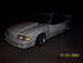 1991 Ford Mustang - A white 1991 Ford Mustang coupe is shown at a 3/4 front angle, a prominent hood scoop.