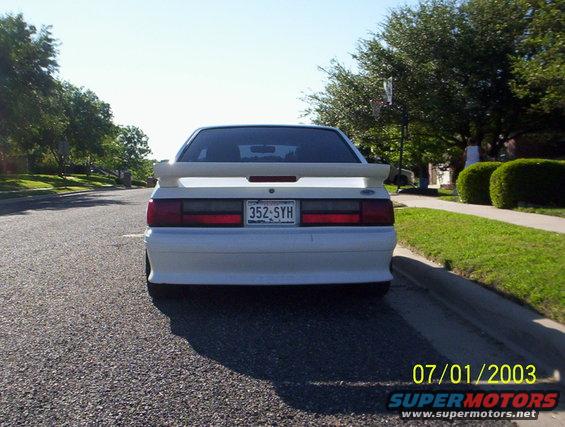 White 1991 Ford Mustang rear view with spoiler and license plate 352-SYH