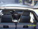 1991 Ford Mustang - Interior view of a 1991 Ford Mustang, captured from the back seat, revealing the dashboard and instrument cluster.