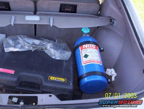 Trunk interior with blue NOS tank and black Stanley tool case. Date stamp 07/01/2003