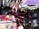 1991 Ford Mustang - Close-up of an engine bay red spark plug wires and a purple fluid reservoir, with a date stamp of 07/01/2003.