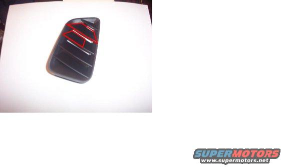 dark car part with red accents and horizontal lines