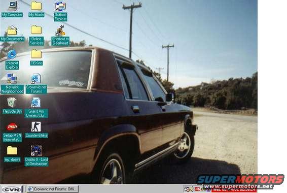 Maroon 1986 Ford Crown Victoria LTD 3q front view parked on dirt road