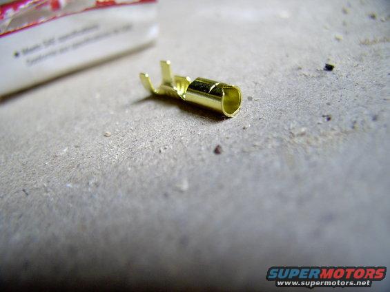 img_0436.jpg For around a buck I got a whole package of these handy dandy little terminals. Not an exact fit, but with a little persuasion from a tapered punch, it works very well in place.