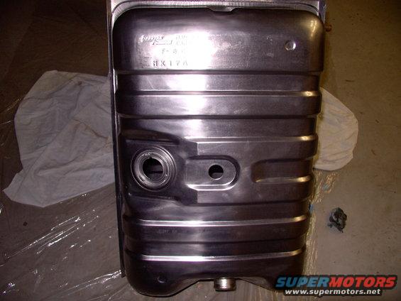 img_0455.jpg Beautiful new Canadian made steel tank for $130.00 CDN. How do they do it ! Note the smaller 2" opening for the 86 style sender unit, as opposed to later model 3 5/8" openings.