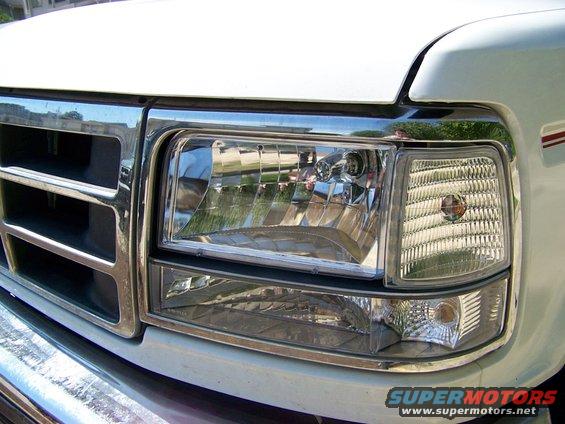 White Ford truck front grille and headlight assembly. 1992 model