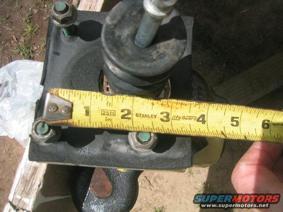 Brake booster assembly measured with a tape measure