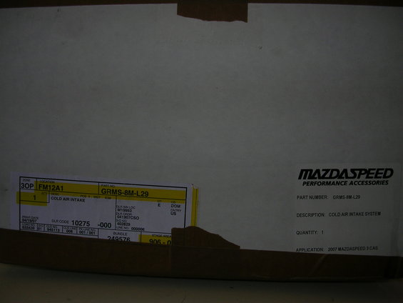 Mazdaspeed cold air intake box with labels showing part number GRMS-8M-L29 and application 2007 Mazdaspeed 3