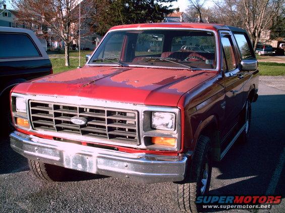 Red 1986 Ford Bronco front grille and hood