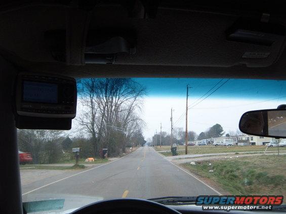 Aftermarket stereo mounted on the interior dashboard of a vehicle