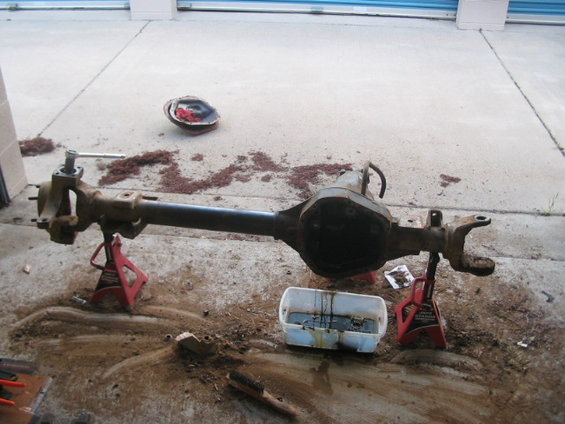 Dana 60 front axle assembly on jack stands with oil pan