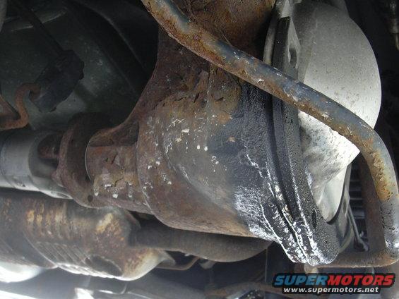 Rear differential and exhaust system with rust and oil leaks